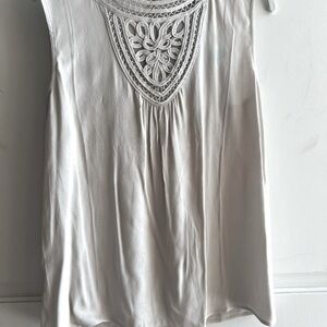 Sleeveless blouse. Grey